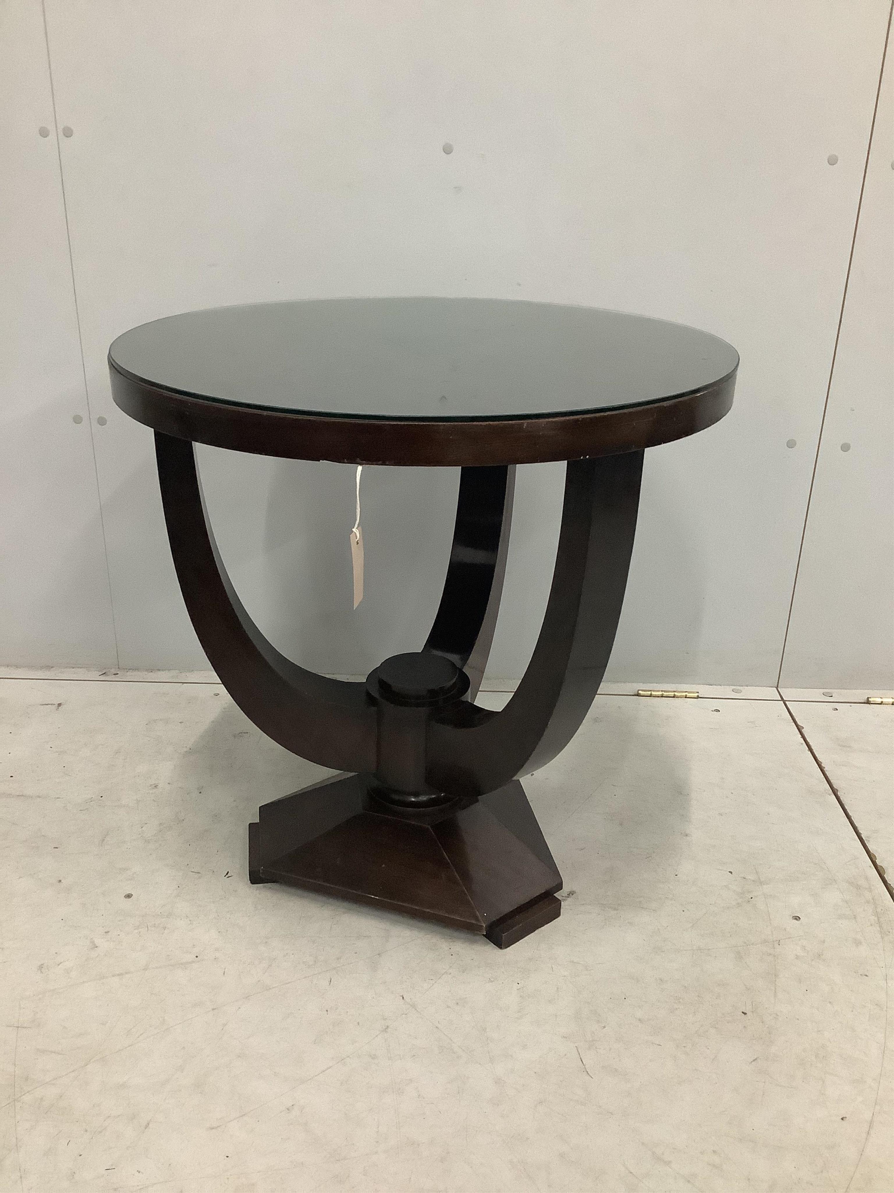 An Art Deco circular mahogany occasional table, diameter 70cm, height 71cm. Condition - fair